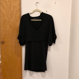 Black v-neck dress with a cape back